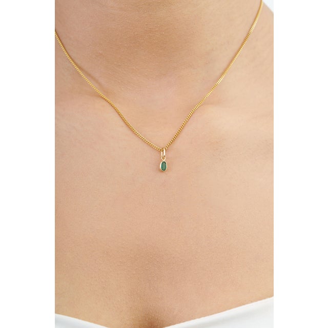 Add a touch of timeless elegance to your jewelry collection with our dainty emerald pendant charm. Featuring a beautiful...