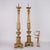 Pair of carved and gilded wooden torch holders with repeated motif decorations, flowered festoons, pods and grooves. This...