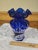 The Fenton 100th Anniversary Cobalt Blue HP Deer in Winter Scene Glass Hexagon Vase is a stunning piece of art glass...