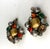 This is part of Chairish’s Costume Jewelry assortment. These are a unique pair of Kramer clip on earrings with rich colors...