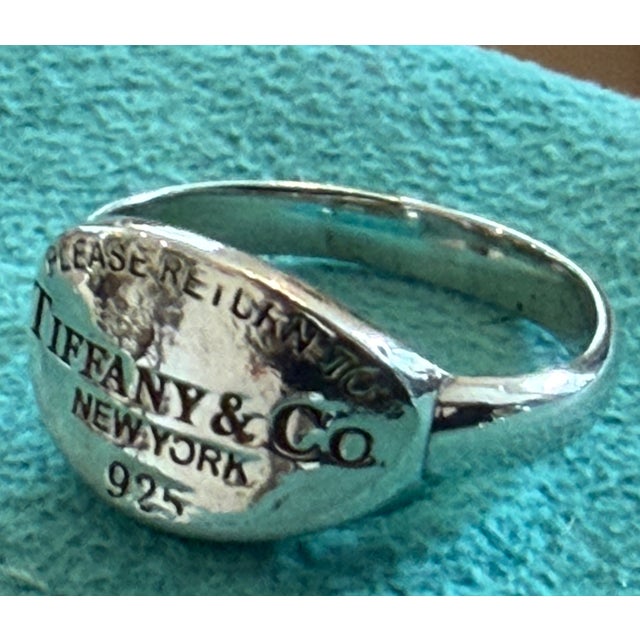 Iconic Sterling Silver "Please Return to Tiffany & Co. New York 925" oval tag ring in Size 6 with Tiffany blue...
