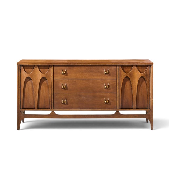Broyhill Brasilia Mid Century Walnut and Brass Credenza This credenza measures: 56 wide x 17 deep x 28 inches high Fair...