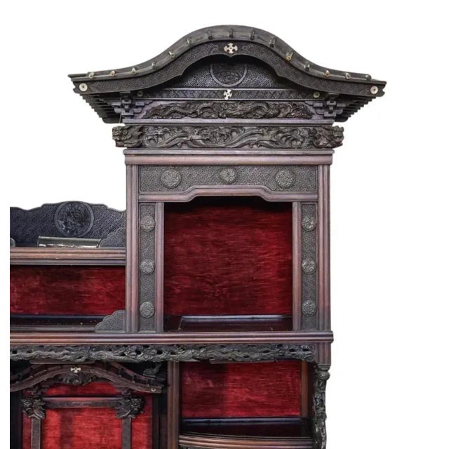 Monumental Japanese Meiji Shibayama cabinet, the structure crested by a pair of well carved dragons, topped with roof...