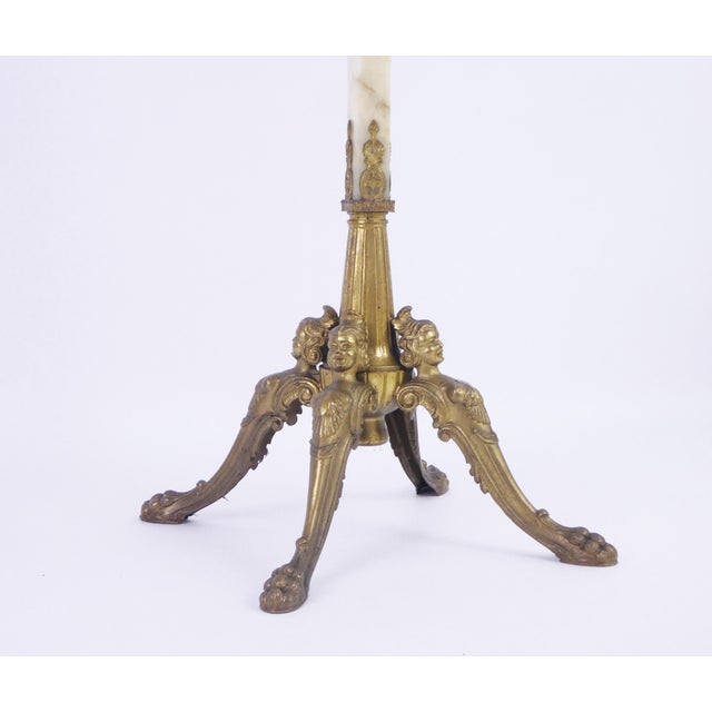 Mid-century iconic Italian onyx marble coat rack with a brass crown and legs. In the middle you will find an ornate brass...