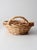 This large vintage oval gathering basket features an open handwoven pattern and gracefully arched handles that highlight...