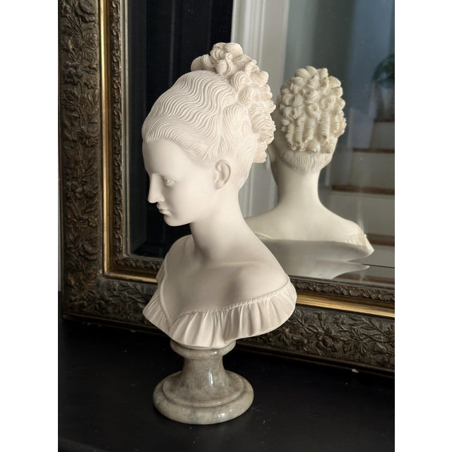 Antique and exquisite, large sculpture of Manon Lescaut, a young woman with a chignon, carved in alabaster or resin on a...