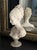 Antique and exquisite, large sculpture of Manon Lescaut, a young woman with a chignon, carved in alabaster or resin on a...