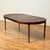 Dining table was manufactured in Denmark in the 1950s-60s . It is made of Santos rosewood veneer on top surface and in...