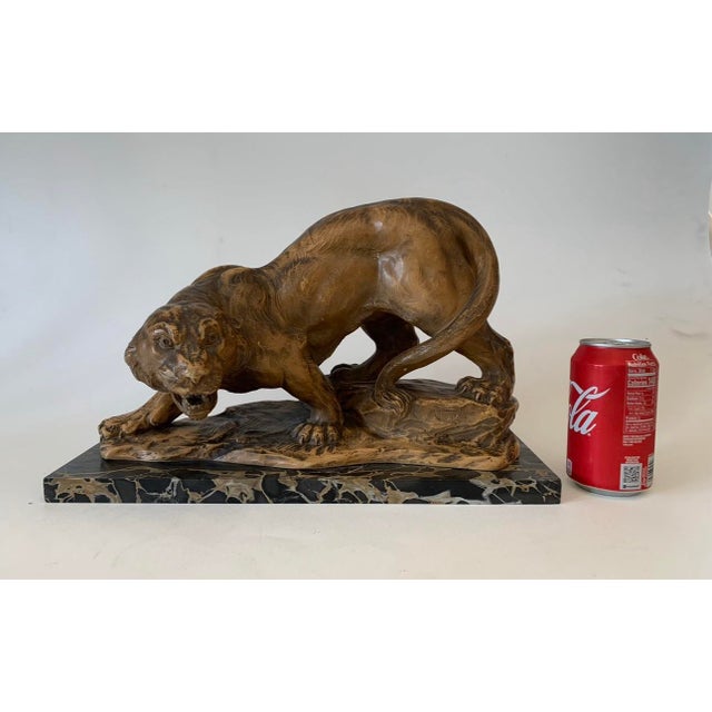 Beautiful piece in Terracotta in the Art Deco style and period, signed on the terracotta Jugi and mounted on a spectacular...