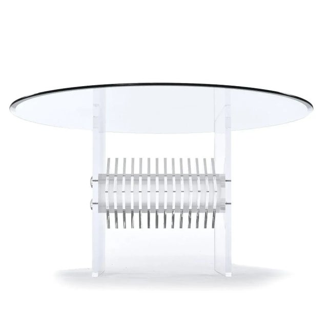 This listing is for the table alone. The chairs are sold separately. Post Modern clear acrylic pedestal dining table with...