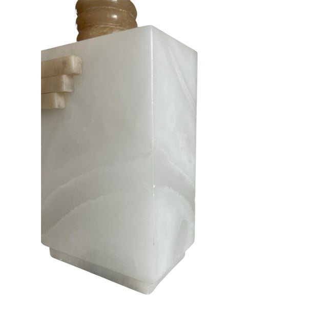 Chic alabaster table lamp in off white. Original shade with decor stitching.