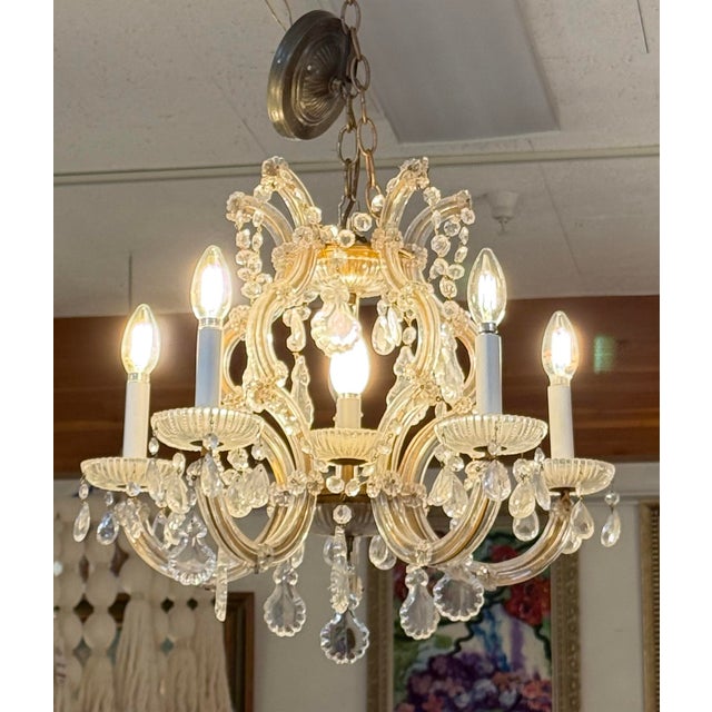 Design Plus Gallery presents a Chandelier in the Style of Maria Theresa by Omega Lighting. Named after Empress Maria...
