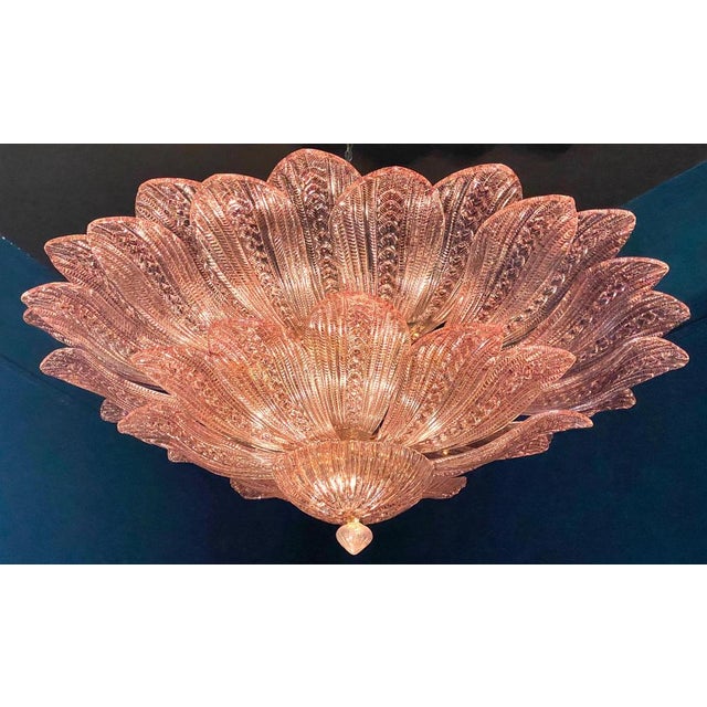 Realized in pure pink amethyst color Murano glass consists of 45 delicious hand-blown leaves. The structure is gilt-metal....