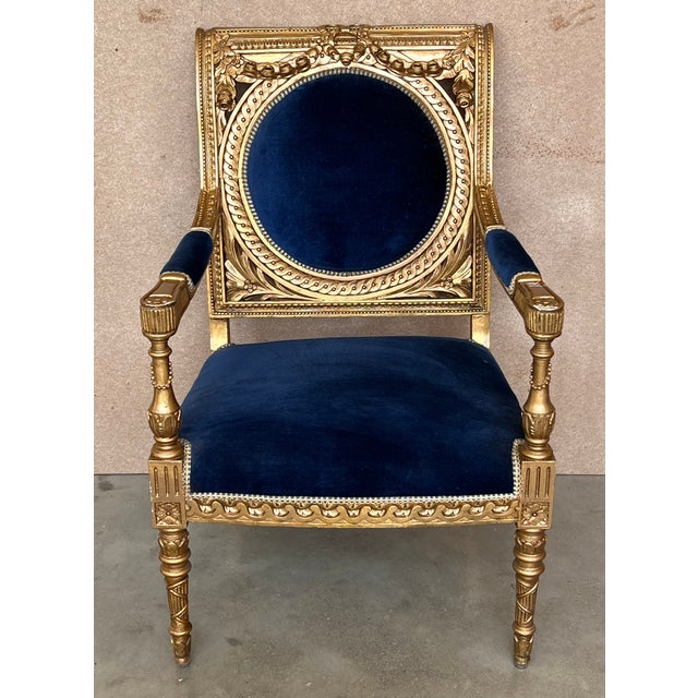 Louis XVI style armchair with medallion backrest. Elegantly carved and hand finished in a two tone patina, gilded or ecru,...