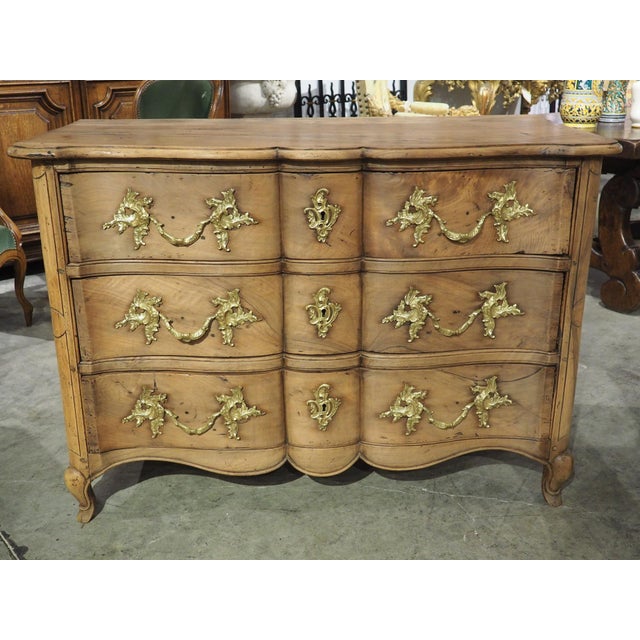 More information coming soon… A beautiful period Louis XV commode, with a crossbow front and luxurious golden bronze...