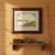 **“One for Lunch” by Bob White** is a signed, limited-edition fine art print depicting anglers along a remote riverbank,...