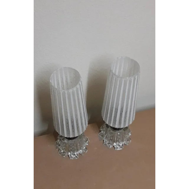Pair of vintage bedside lamps with clear relief glass base, chrome metal mount and relief glass shade with white stripe...