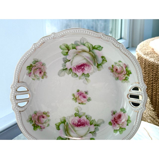 1920s P.K. Silesia Handled Cake Plate, a German antique porcelain platter featuring hand-painted pink roses, scalloped...