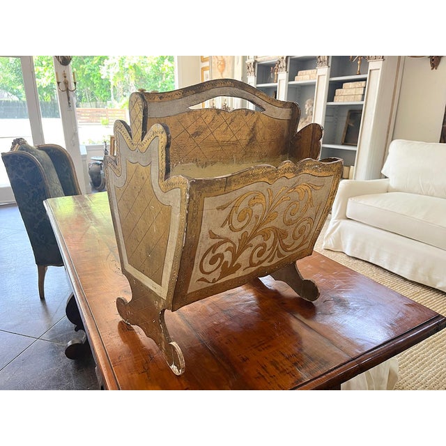This Florentine magazine rack has beautiful gold detailing throughout. Its handle makes it convenient to move throughout...