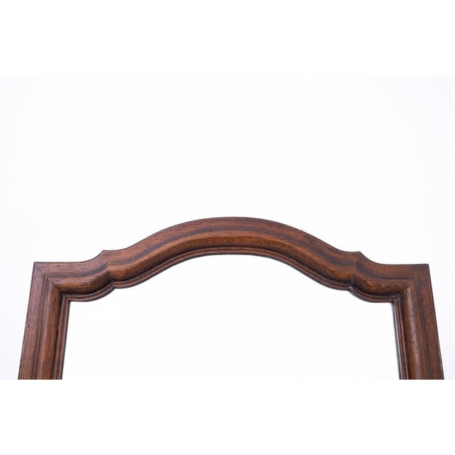 Narrow oak mirror, France, circa 1910. Very good condition. Mirror dimensions: height 171 cm, width 70 cm