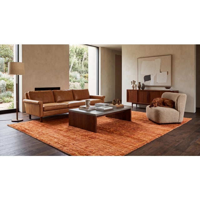 Elevate high-end interiors with this hand-knotted Modern Moroccan-style area rug, rendered in a warm terracotta and sun-...