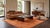Elevate high-end interiors with this hand-knotted Modern Moroccan-style area rug, rendered in a warm terracotta and sun-...