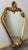 A charming Vintage French gilt wall mirror with an elegant Rococo-inspired frame and rich gold tones. Its curvaceous...