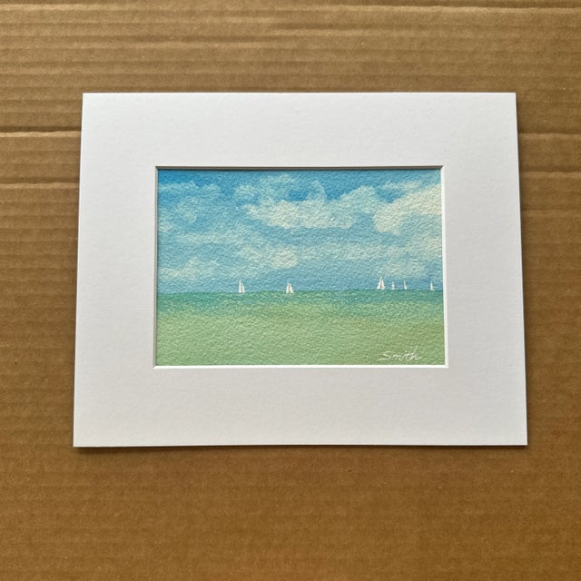 Set sail with this breezy seascape featuring a distant regatta under a cloud-filled sky. Crisp greens and blues give this...