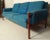 Stunning vintage mid-century modern Scandinavian sofa in the style of renowned Danish designer, Finn Juhl. Featuring a...