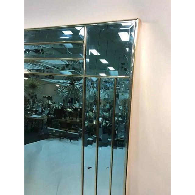 A Brass Framed Multi Linear wall-mounted mirror with modernistic details designed in 1970s. Great vintage condition.