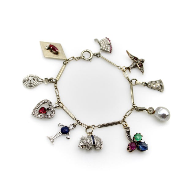 We love these Art Deco charm bracelets because the charms of the era were so special, and usually diamond and gemstone...