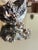 1940s sterling silver floral panel bracelet featuring dimensional botanical repoussé work and sculptural flower motifs....