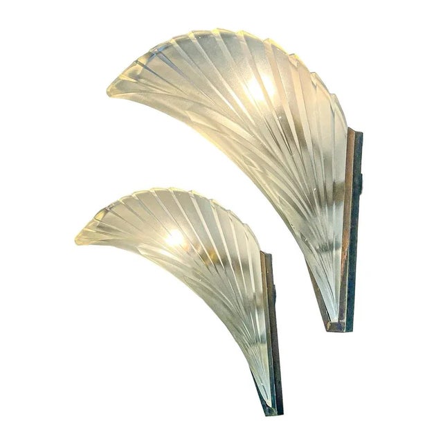 Beautiful original 1930s French Art Deco glass wall lamp. Thick, heavy frosted glass in “feather” shape. It is held by a...