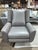 The "Luke" Swivel Recliner from Restoration Hardware offers a refined fusion of comfort and modern design. Upholstered in...