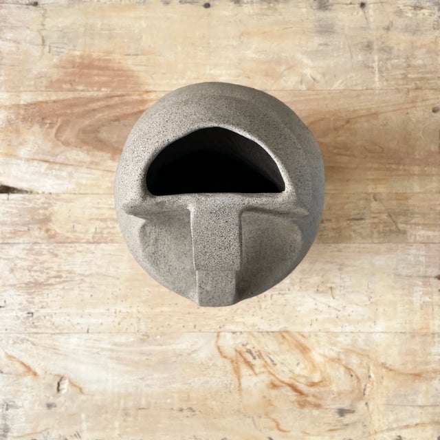 The handcrafted Riye ceramic vase blends modern design with timeless artistry. Its natural, unfinished texture gives it an...