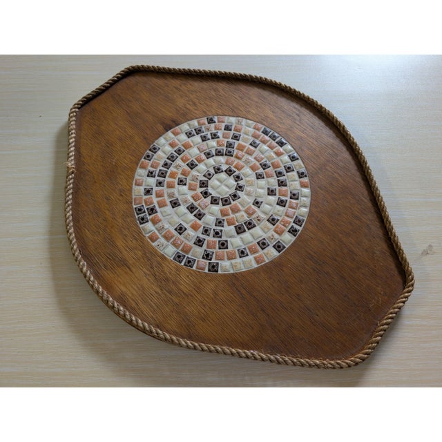 The Vintage Mid Century Modern MCM Mosaiac Wood Trivet is a decorative piece that embodies the style of the 1960s....