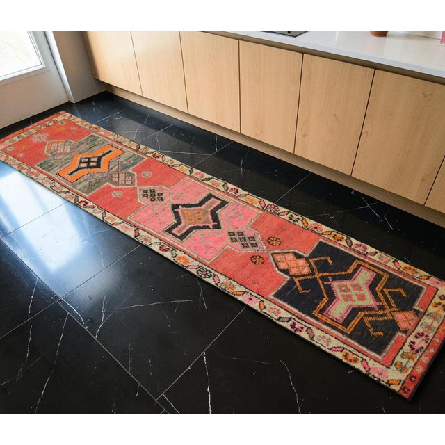 Hand-knotted in Southeastern Anatolia during the 1960s, this extraordinary runner rug was originally crafted by village...