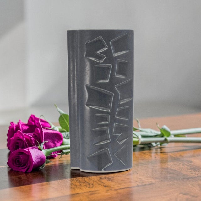Vintage Mid-Century Modern ceramic vase dating circa 1968–1985. Executed in molded ceramic with a matte metallic gray-...