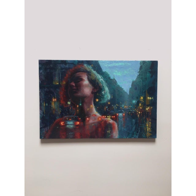 Dreaming of the City 2 presents a striking interplay between a contemplative figure and a vibrant urban backdrop. The oil...
