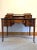 This antique Carlton House Desk was manufactured by H. Mawer & Stevenson (London) with inlaid marquetry detailing Urns,...