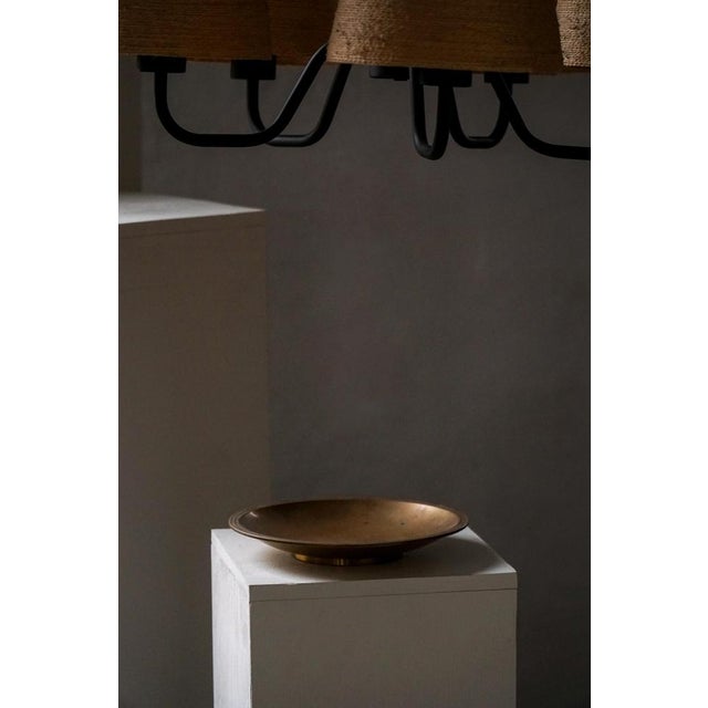 A refined patinated bronze bowl designed by danish artist just andersen (1884–1943), dating to the art deco period, circa...