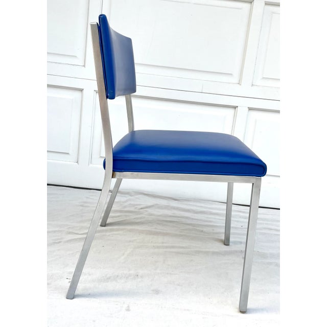 Here is a wonderful bright blue and steel chair from the later 20th century, most likely the 1970-80's. It was made by...