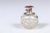 An English crystal toiletry bottle from the 19th century with silver lid and star motifs. Born in England during the reign...