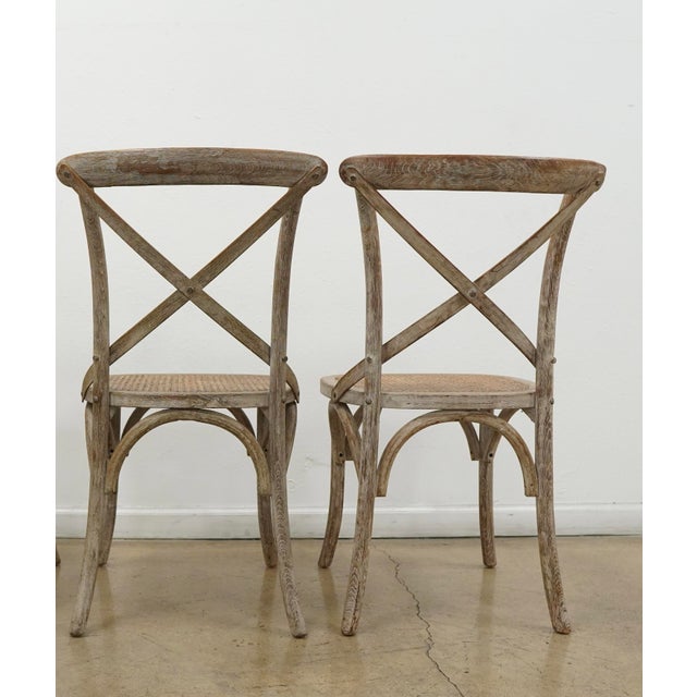 Modeled after the iconic café chairs long associated with European bistros, this X-back dining chair pays homage to the...