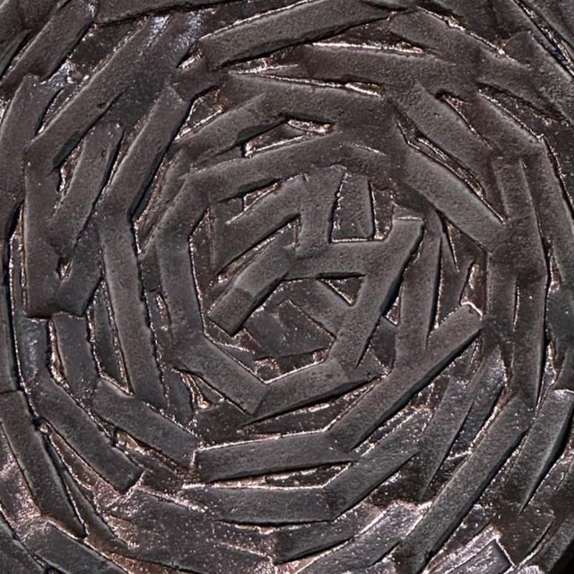 Single round door handle with spiralling relief that is textured. Cast bronze relief in perfect condition. The bronze has...