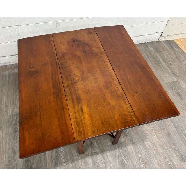 This is a stunning antique George III Chippendale-style mahogany drop-leaf table, likely dating to the late 18th or early...