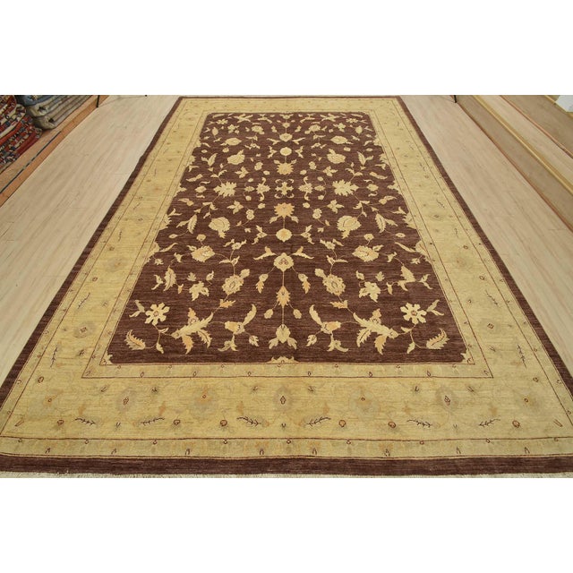 This traditional Ziegler rug is hand-knotted with an all-wool pile on a cotton foundation. This rug is new and in...