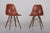 Charles & ray eames, orange/sienna fiberglass chairs, model dsw. this color, introduced to the herman miller catalog in...