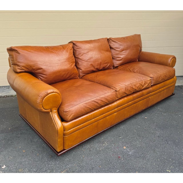 Ralph Lauren Wentworth Sofa in classic RL camel leather with down back cushions and down wrapped seat cushions. The sofa...