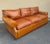 Ralph Lauren Wentworth Sofa in classic RL camel leather with down back cushions and down wrapped seat cushions. The sofa...